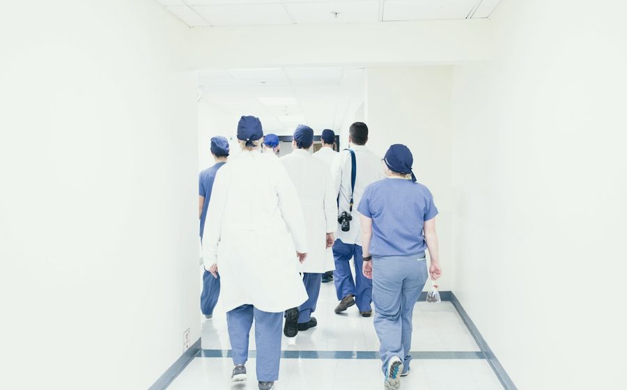 Clinical staff walking a hospital corridor
