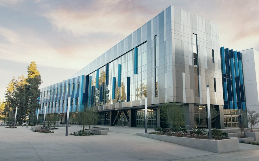 A modern hospital building at dusk